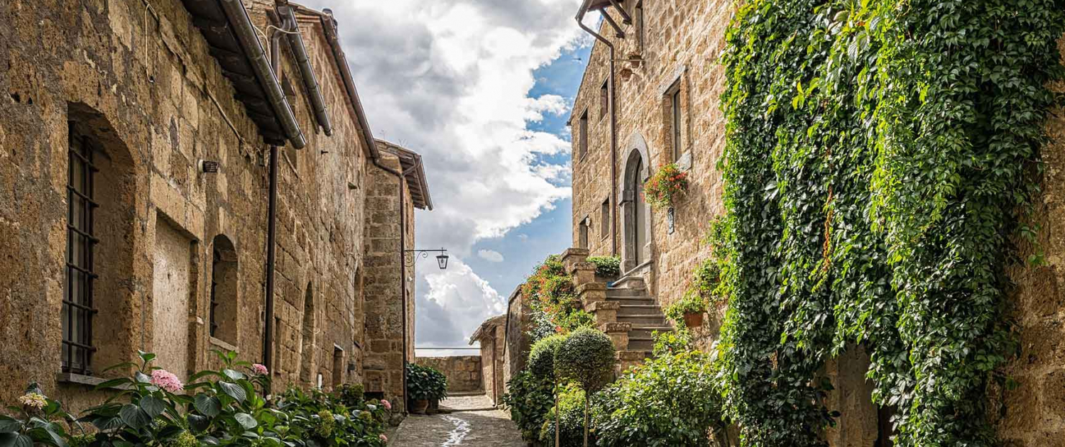 An alley between rustic village houses in Italy